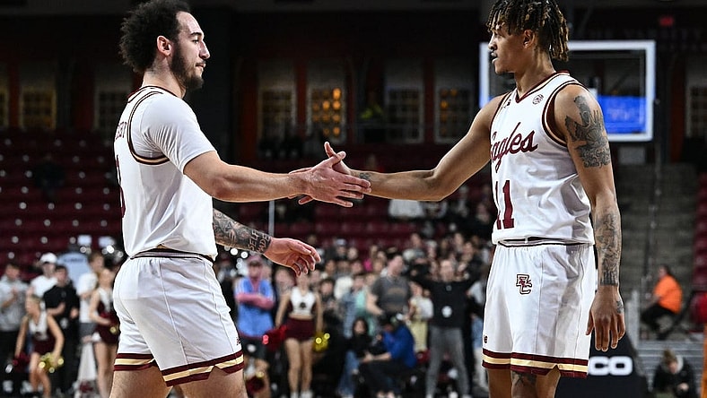 Jan 31, 2023; Chestnut Hill, Massachusetts, USA; Boston College Eagles guard Jaeden Zackery (3) reacts with guard Makai Ashton-Langford (11) during a timeout in first half of a game against the Clemson Tigers at the Conte Forum. Mandatory Credit: Brian Fluharty-USA TODAY Sports