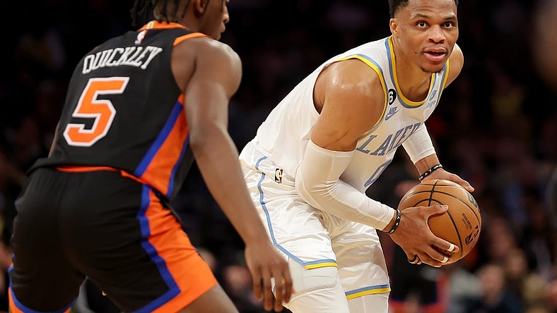 Jan 31, 2023; New York, New York, USA; Los Angeles Lakers guard Russell Westbrook (0) controls the ball against New York Knicks guard Immanuel Quickley (5) during overtime at Madison Square Garden. Mandatory Credit: Brad Penner-USA TODAY Sports