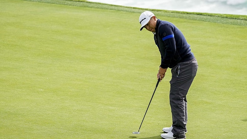 February 3, 2023; Pebble Beach, California, USA; Kurt Kitayama putts on the eighth hole during the second round of the AT&T Pebble Beach Pro-Am golf tournament at Pebble Beach Golf Links. Mandatory Credit: Ray Acevedo-USA TODAY Sports