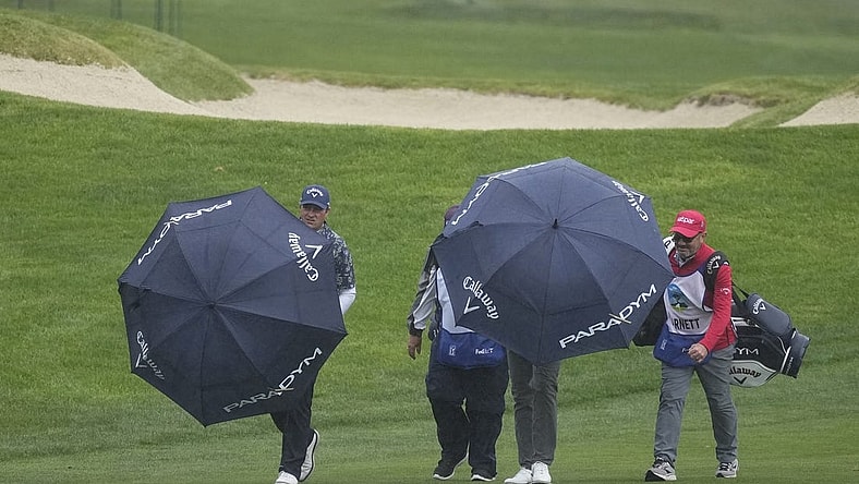 Feb 4, 2023; Pebble Beach, California, USA; Brian Stuard (left) walks with his group up the ninth fairway during the third round of the AT&T Pebble Beach Pro-Am golf tournament at Spyglass Hill Golf Course. Mandatory Credit: Ray Acevedo-USA TODAY Sports