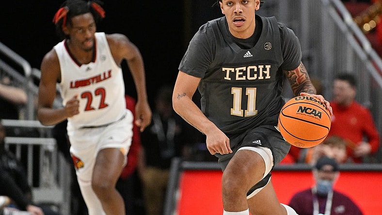 Feb 1, 2023; Louisville, Kentucky, USA;  Georgia Tech Yellow Jackets guard Tristan Maxwell (11) dribbles against the Louisville Cardinals during the first half at KFC Yum! Center. Louisville defeated Georgia Tech 68-58. Mandatory Credit: Jamie Rhodes-USA TODAY Sports
