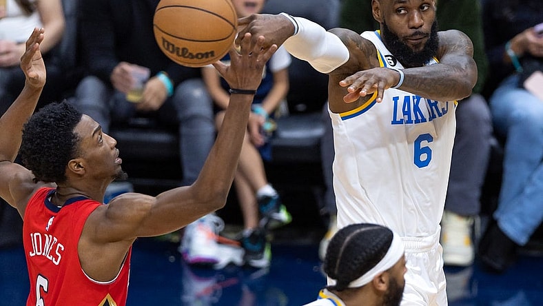 Feb 4, 2023; New Orleans, Louisiana, USA;  Los Angeles Lakers forward LeBron James (6) passes the ball against New Orleans Pelicans forward Herbert Jones (5) during the second half at Smoothie King Center. Mandatory Credit: Stephen Lew-USA TODAY Sports