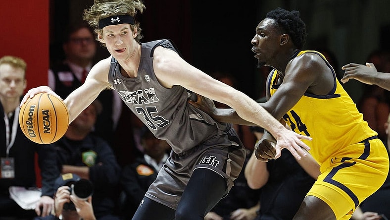 Feb 5, 2023; Salt Lake City, Utah, USA; Utah Utes center Branden Carlson (35) looks to drive against California Golden Bears forward Sam Alajiki (24) in the first half at Jon M. Huntsman Center. Mandatory Credit: Jeffrey Swinger-USA TODAY Sports