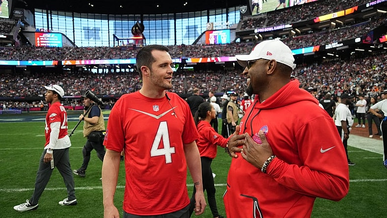 Feb 5, 2023; Paradise, Nevada, USA; AFC quarterback Derek Carr of the Las Vegas Raiders (4) talks with defensive coordinator Ray Lewis against the NFC during the Pro Bowl Games at Allegiant Stadium. Mandatory Credit: Kirby Lee-USA TODAY Sports