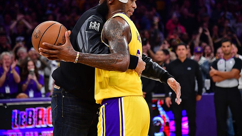 Feb 7, 2023; Los Angeles, California, USA; Former Los Angeles Lakers player Kareem Abdul-Jabbar hugs forward LeBron James (6) after James becomes the all time NBA scoring leader againt the Oklahoma City Thunder during the second half at Crypto.com Arena. Mandatory Credit: Gary A. Vasquez-USA TODAY Sports
