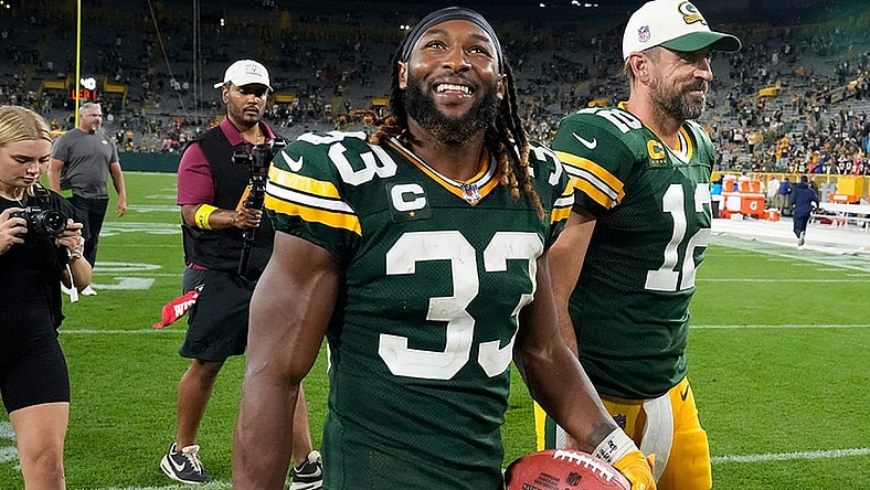 Green Bay Packers running back Aaron Jones (33) and Green Bay Packers quarterback Aaron Rodgers (12) walk of the after their game against the Green Bay Packers on Sunday, Sept. 18, 2022 at Lambeau Field in Green Bay.

Best 2022 26