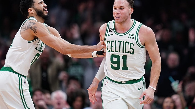 Feb 8, 2023; Boston, Massachusetts, USA; Boston Celtics forward Jayson Tatum (0) reacts after forward Blake Griffin (91) makes a three point basket against the Philadelphia 76ers in the second half at TD Garden. Mandatory Credit: David Butler II-USA TODAY Sports