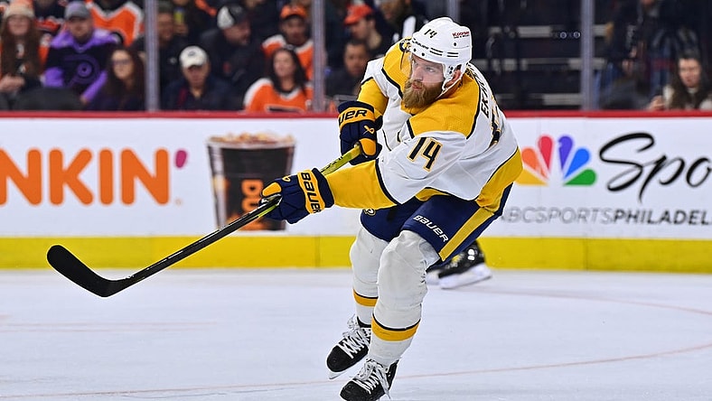 Feb 11, 2023; Philadelphia, Pennsylvania, USA; Nashville Predators defenseman Mattias Ekholm (14) clears the puck against the Philadelphia Flyers in the first period at Wells Fargo Center. Mandatory Credit: Kyle Ross-USA TODAY Sports