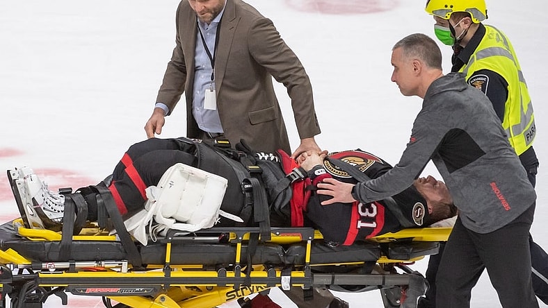 Feb 11, 2023; Ottawa, Ontario, CAN; Ottawa Senators goalie Anton Forsberg (31) is carried off the ice on a stretcher after being injured on a play in the third period against the Edmonton Oilers at the Canadian Tire Centre. Mandatory Credit: Marc DesRosiers-USA TODAY Sports