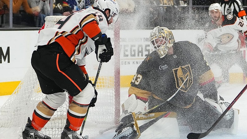 Feb 12, 2023; Las Vegas, Nevada, USA; Vegas Golden Knights goaltender Adin Hill (33) defends his net against Anaheim Ducks center Adam Henrique (14) during the first period at T-Mobile Arena. Mandatory Credit: Stephen R. Sylvanie-USA TODAY Sports