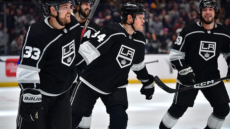 Feb 13, 2023; Los Angeles, California, USA; Los Angeles Kings right wing Arthur Kaliyev (34) celebrates his power play goal scored against the Buffalo Sabres with right wing Viktor Arvidsson (33) and defenseman Sean Durzi (50) during the second period at Crypto.com Arena. Mandatory Credit: Gary A. Vasquez-USA TODAY Sports