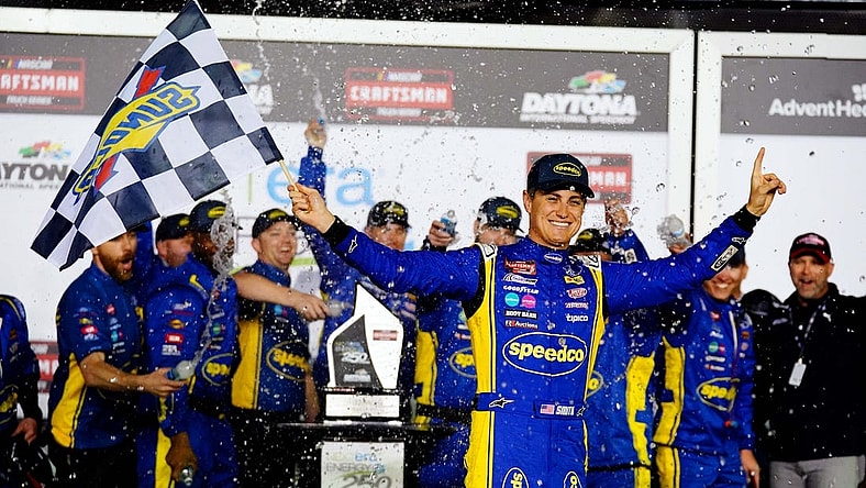 Feb 17, 2023; Daytona Beach, Florida, USA; NASCAR Truck Series driver Zane Smith (38) celebrates in victory lane after being declared the winner following a rain shortened NextEra Energy 250 race at Daytona International Speedway. Mandatory Credit: John David Mercer-USA TODAY Sports