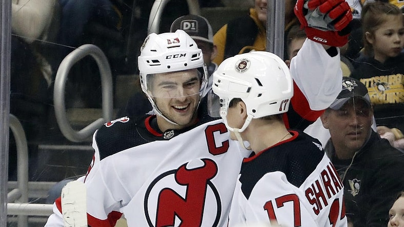 Feb 18, 2023; Pittsburgh, Pennsylvania, USA;  New Jersey Devils center Nico Hischier (13) celebrates with center Yegor Sharangovich (17) after Hischier scored a goal against the Pittsburgh Penguins during the second period at PPG Paints Arena. Mandatory Credit: Charles LeClaire-USA TODAY Sports