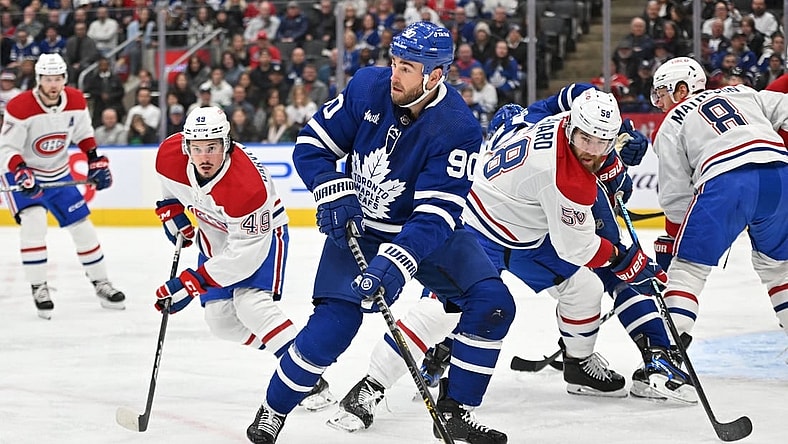 Feb 18, 2023; Toronto, Ontario, CAN;   Toronto Maple Leafs forward Ryan O'Reilly (90) looks for a passing option against the Montreal Canadiens in the first period at Scotiabank Arena. Mandatory Credit: Dan Hamilton-USA TODAY Sports