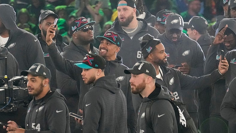Philadelphia Eagles quarterback Jalen Hurts takes a picture on stage at the Footprint Center in downtown Phoenix during the NFL's Super Bowl Opening Night on Feb. 6, 2023.

Nfl Super Bowl Opening Night At Footprint Center
