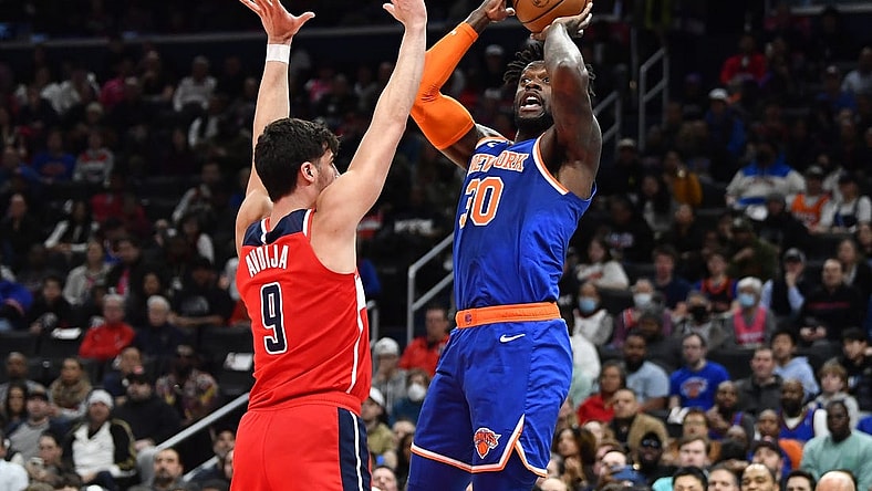 Feb 24, 2023; Washington, District of Columbia, USA; New York Knicks forward Julius Randle (30) shoots over Washington Wizards forward Deni Avdija (9) during the first half at Capital One Arena. Mandatory Credit: Brad Mills-USA TODAY Sports