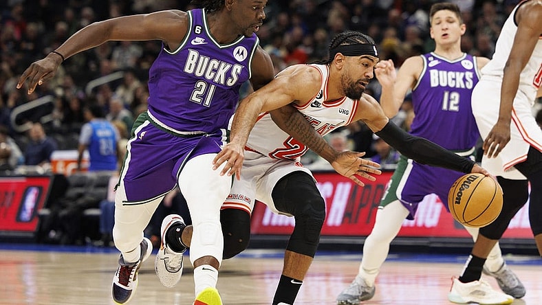 Feb 24, 2023; Milwaukee, Wisconsin, USA;  Miami Heat guard Gabe Vincent (2) drives for the basket against Milwaukee Bucks guard Jrue Holiday (21) during the third quarter at Fiserv Forum. Mandatory Credit: Jeff Hanisch-USA TODAY Sports