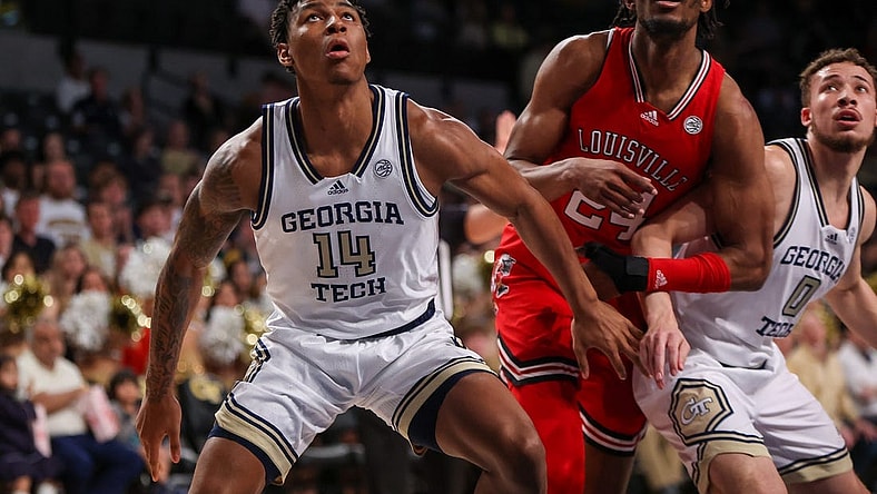 Feb 25, 2023; Atlanta, Georgia, USA; Georgia Tech Yellow Jackets forward Jalon Moore (14) boxes out Louisville Cardinals forward Jae'Lyn Withers (24) in the first half at McCamish Pavilion. Mandatory Credit: Brett Davis-USA TODAY Sports