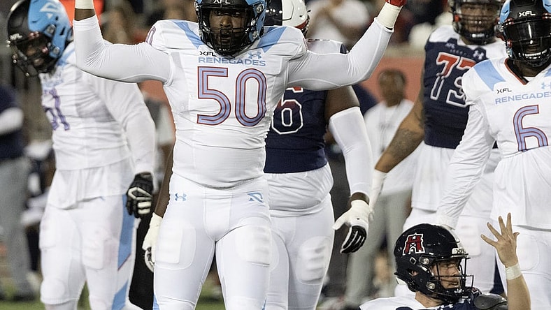 Feb 26, 2023; Houston, TX, USA;  Houston Roughnecks quarterback Brandon Silvers (12) looks for a horse collar call against Arlington  Renegades linebacker Willie Taylor (50) in the third quarter  at TDECU Stadium. Nom penalty was called on the play. Mandatory Credit: Thomas Shea-USA TODAY Sports