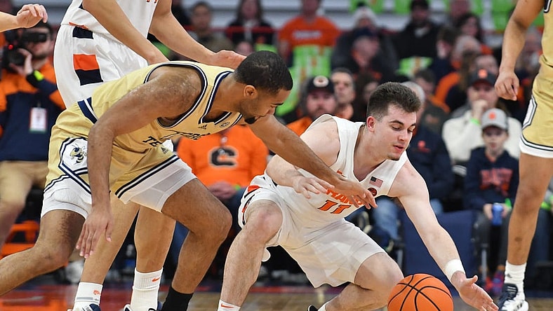 Feb 28, 2023; Syracuse, New York, USA; Syracuse Orange guard Joseph Girard III (11) and Georgia Tech Yellow Jackets guard Kyle Sturdivant (1) go for a loose ball in the first half at the JMA Wireless Dome. Mandatory Credit: Mark Konezny-USA TODAY Sports