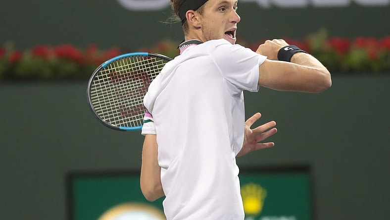 Nicolas Jarry returns a shot to Frances Tiafoe at the BNP Paribas Open, Indian Wells, Calif., March 8, 2019.

Tiafoe 7