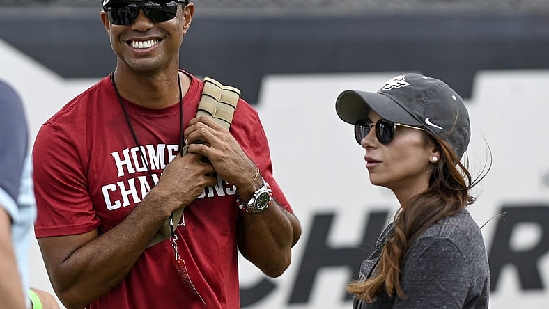 Sep 14, 2019; Orlando, FL, USA; PGA golfer Tiger Woods (red shirt) and girlfriend Erica Herman look on prior to the game between the UCF Knights and the Stanford Cardinals at Spectrum Stadium. Mandatory Credit: Douglas DeFelice-USA TODAY Sports