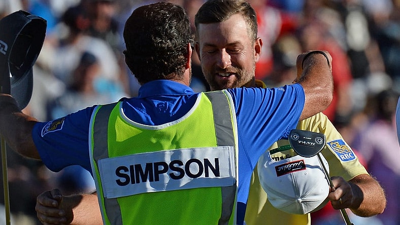 Feb 2, 2020; Scottsdale, Arizona, USA; Webb Simpson hugs his caddie Paul Tesori after winning the Waste Management Phoenix Open golf tournament at TPC Scottsdale. Mandatory Credit: Joe Camporeale-USA TODAY Sports