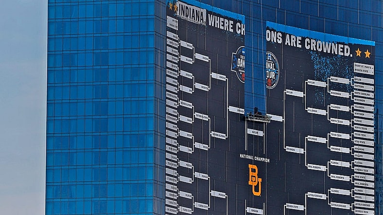 A bird gets an aerial view as the giant March Madness basketball bracket sign begins to come down Tuesday, April 6, 2021 off the J.W. Marriott in downtown Indianapolis, after March Madness and Final Four finished.

With March Madness And Final Four Finished Signage Comes Down