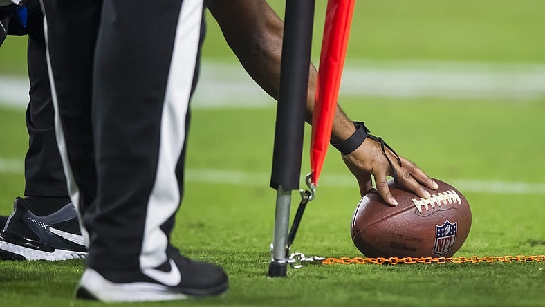 Oct 28, 2021; Glendale, Arizona, USA; Detailed view as referee measures the football for a first down with yard markers during the Arizona Cardinals game against the Green Bay Packers at State Farm Stadium. Mandatory Credit: Mark J. Rebilas-USA TODAY Sports