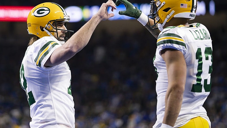 Jan 9, 2022; Detroit, Michigan, USA; Green Bay Packers wide receiver Allen Lazard (13) and quarterback Aaron Rodgers (12) celebrate together after connecting for a touchdown during the second quarter against the Detroit Lions at Ford Field. Mandatory Credit: Raj Mehta-USA TODAY Sports