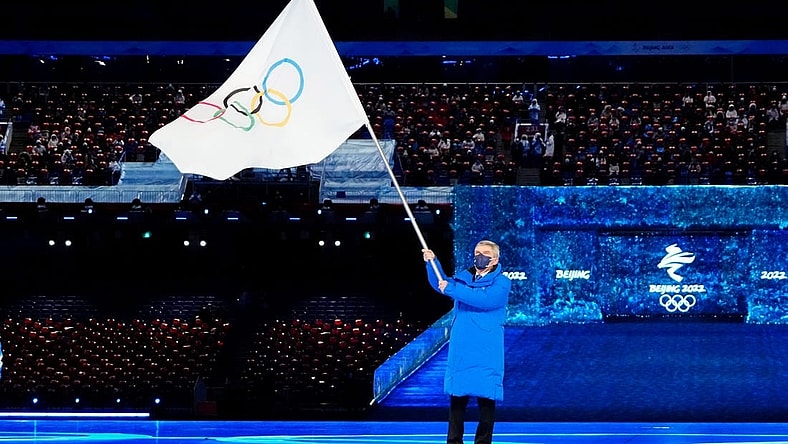 Feb 20, 2022; Beijing, CHINA; IOC president Thomas Bach waves the Olympic flag during the closing ceremony for the Beijing 2022 Olympic Winter Games at Beijing National Stadium. Mandatory Credit: Rob Schumacher-USA TODAY Sports