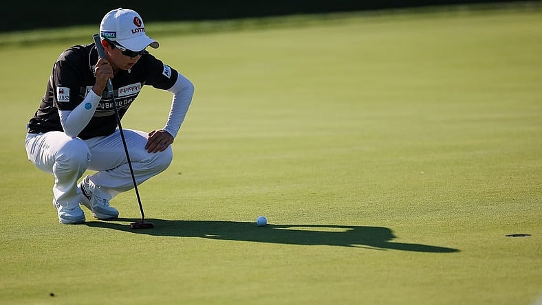 Jun 24, 2022; Bethesda, Maryland, USA; Hyo Joo Kim lines up a putt on the 18th green during the second round of the KPMG Women's PGA Championship golf tournament at Congressional Country Club. Mandatory Credit: Scott Taetsch-USA TODAY Sports