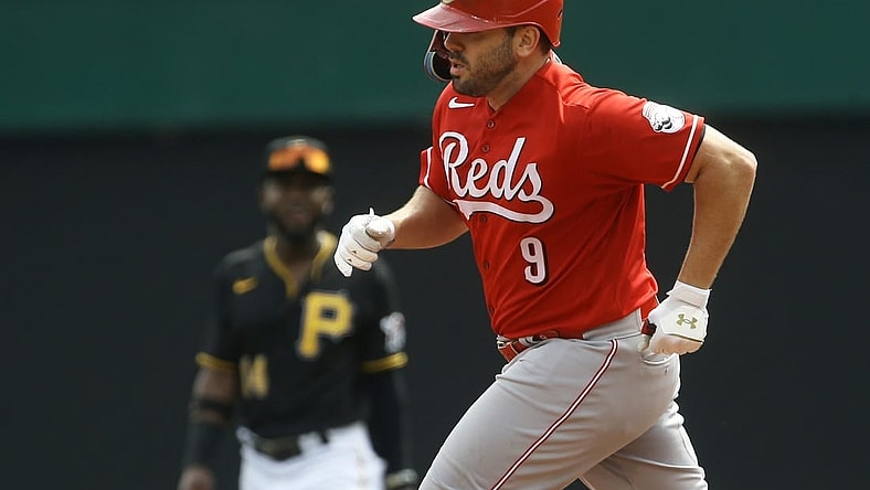 Aug 21, 2022; Pittsburgh, Pennsylvania, USA; Cincinnati Reds first baseman Mike Moustakas (9) rounds the bases after hitting a two run home run against the Pittsburgh Pirates during the third inning at PNC Park. Mandatory Credit: Charles LeClaire-USA TODAY Sports