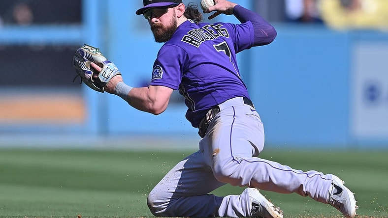 Oct 2, 2022; Los Angeles, California, USA; Colorado Rockies second baseman Brendan Rodgers (7) makes a play to throw out Los Angeles Dodgers first baseman Freddie Freeman (5) at second base in the sixth inning at Dodger Stadium. Mandatory Credit: Jayne Kamin-Oncea-USA TODAY Sports