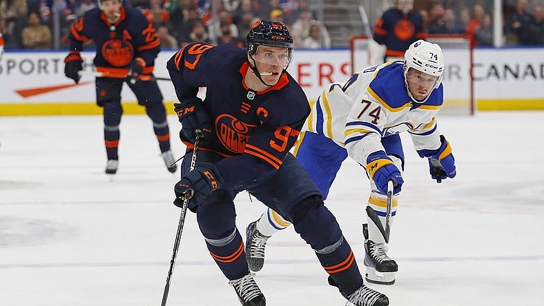 Oct 18, 2022; Edmonton, Alberta, CAN; Buffalo Sabres forward Rasmus Asplund (74) chases Edmonton Oilers forward Connor McDavid (97) up the ice during the third period at Rogers Place. Mandatory Credit: Perry Nelson-USA TODAY Sports