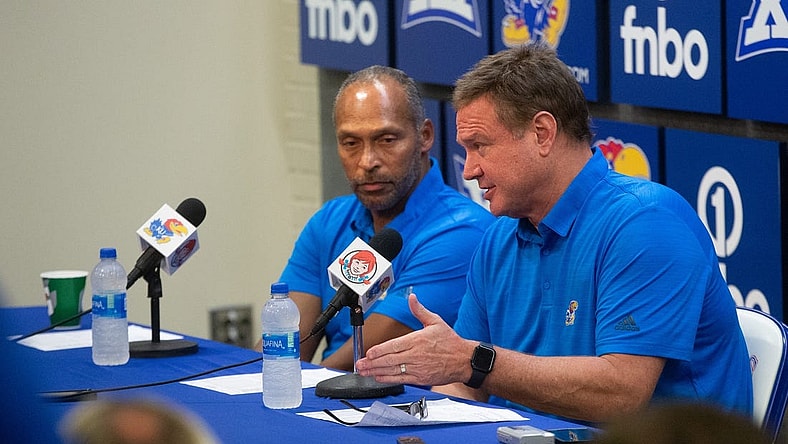 Kansas head coach Bill Self speaks with assistant coach Norm Roberts during a press conference following Thursday's game against Pitt State inside Allen Fieldhouse.
