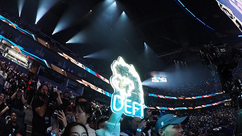 Nov 5, 2022; San Francisco, California, USA; A fan holds a sign for DRX bot laner Kim "Deft" Hyuk-kyu (not pictured) after winning the League of Legends World Championships against T1 at Chase Center. Mandatory Credit: Kelley L Cox-USA TODAY Sports