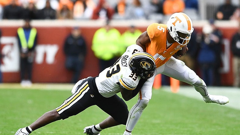 ***DUP***Tennessee quarterback Hendon Hooker (5)/Tennessee defensive back Kamal Hadden(5) is pulled down by Missouri linebacker Chad Bailey (33) during the NCAA college football game on Saturday, November 12, 2022 in Knoxville, Tenn.

Ut Vs Missouri