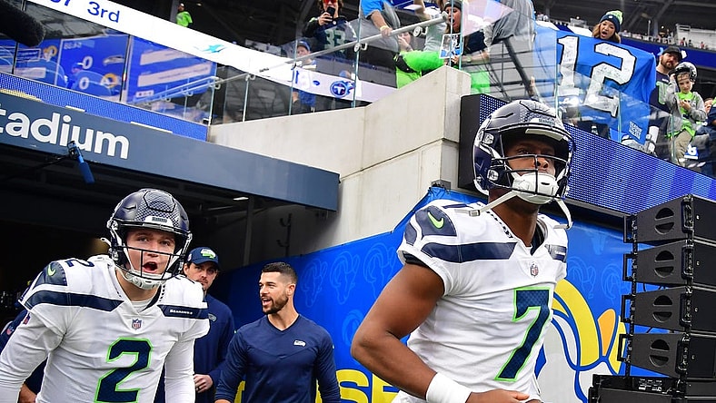 Dec 4, 2022; Inglewood, California, USA; Seattle Seahawks quarterback Geno Smith (7) and quarterback Drew Lock (2) take the field before playing against the Los Angeles Rams at SoFi Stadium. Mandatory Credit: Gary A. Vasquez-USA TODAY Sports