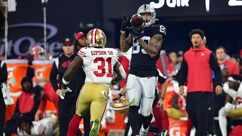 January 1, 2023; Paradise, Nevada, USA; Las Vegas Raiders tight end Darren Waller (83) catches a pass against San Francisco 49ers safety Tashaun Gipson Sr. (31) during the second half at Allegiant Stadium. Mandatory Credit: Gary A. Vasquez-USA TODAY Sports