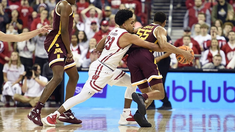 Jan 3, 2023; Madison, Wisconsin, USA;   Wisconsin Badgers guard Chucky Hepburn (23) attempts to steal the ball from Minnesota Golden Gophers guard Ta'lon Cooper (55) in the second half at the Kohl Center. Mandatory Credit: Kayla Wolf-USA TODAY Sports