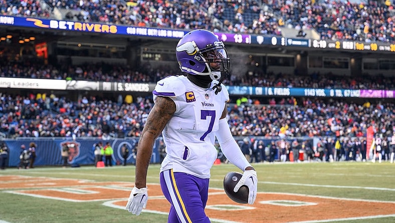 Jan 8, 2023; Chicago, Illinois, USA; Minnesota Vikings cornerback Patrick Peterson (7) celebrates his interception during the second quarter against the Chicago Bears at Soldier Field. Mandatory Credit: Daniel Bartel-USA TODAY Sports