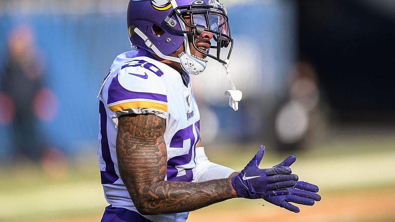 Jan 8, 2023; Chicago, Illinois, USA; Minnesota Vikings cornerback Duke Shelley (20) celebrates a defensive pass break up during the third quarter against the Chicago Bears at Soldier Field. Mandatory Credit: Daniel Bartel-USA TODAY Sports