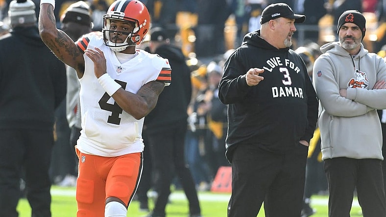 Jan 8, 2023; Pittsburgh, Pennsylvania, USA;  Cleveland Browns quarterback Deshaun Watson (4) throws a practice pass as head coach Kevin Stefanski (right) watches before playing the Pittsburgh Steelers at Acrisure Stadium. Mandatory Credit: Philip G. Pavely-USA TODAY Sports