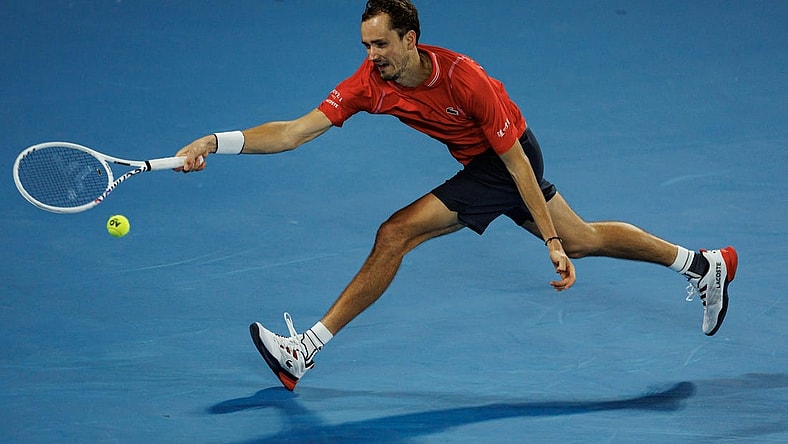 Jan 20, 2023; Melbourne, Victoria, Australia; Daniil Medvedev of Russia hits a shot against Sebastian Korda of the United States on day five of the 2023 Australian Open tennis tournament at Melbourne Park. Mandatory Credit: Mike Frey-USA TODAY Sports