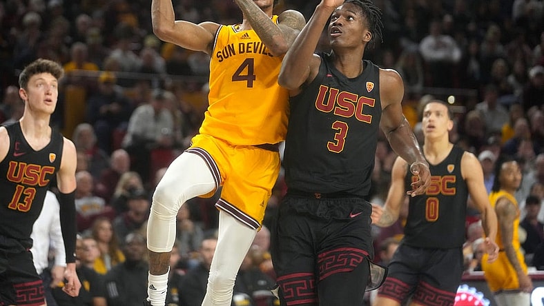 ASU Sun Devil guard Desmond Cambridge Jr. (4) shoots the ball over USC Trojans forward Vincent Iwuchukwu (3) at Desert Financial Arena in Tempe on Jan. 21, 2023.

Basketball Usc Asu Usc At Arizona State