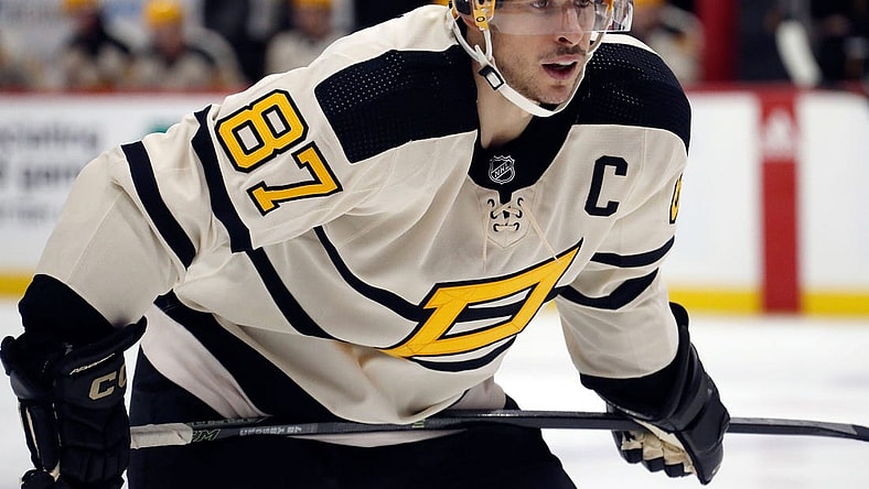 Jan 20, 2023; Pittsburgh, Pennsylvania, USA;  Pittsburgh Penguins center Sidney Crosby (87) prepares to take a face-off against the Ottawa Senators during the third period at PPG Paints Arena. Mandatory Credit: Charles LeClaire-USA TODAY Sports