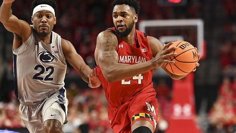 Feb 11, 2023; College Park, Maryland, USA;  Maryland Terrapins forward Donta Scott (24) makes a move to the basket as Penn State Nittany Lions guard Jalen Pickett (22) defends during the second half at Xfinity Center. Mandatory Credit: Tommy Gilligan-USA TODAY Sports