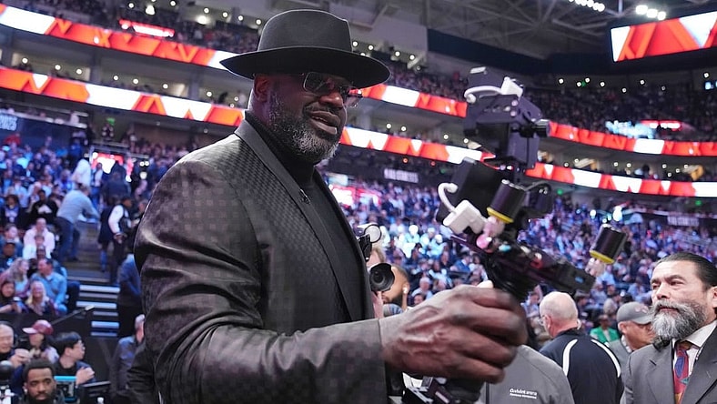 Feb 18, 2023; Salt Lake City, UT, USA; Shaquille O'Neal films himself with a camera during the 2023 All Star Saturday Night at Vivint Arena. Mandatory Credit: Kyle Terada-USA TODAY Sports
