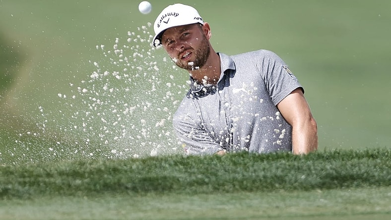 Feb 23, 2023; Palm Beach Gardens, Florida, USA; Adam Svensson plays a shot from a bunker on the third hole during the first round of the Honda Classic golf tournament. Mandatory Credit: Sam Navarro-USA TODAY Sports